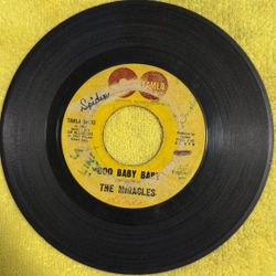 This is a collectible 7-inch vinyl record of the 1965 hit single "Ooo Baby Baby" by The Miracles, released on the Motown subsidiary label, Tamla Recor