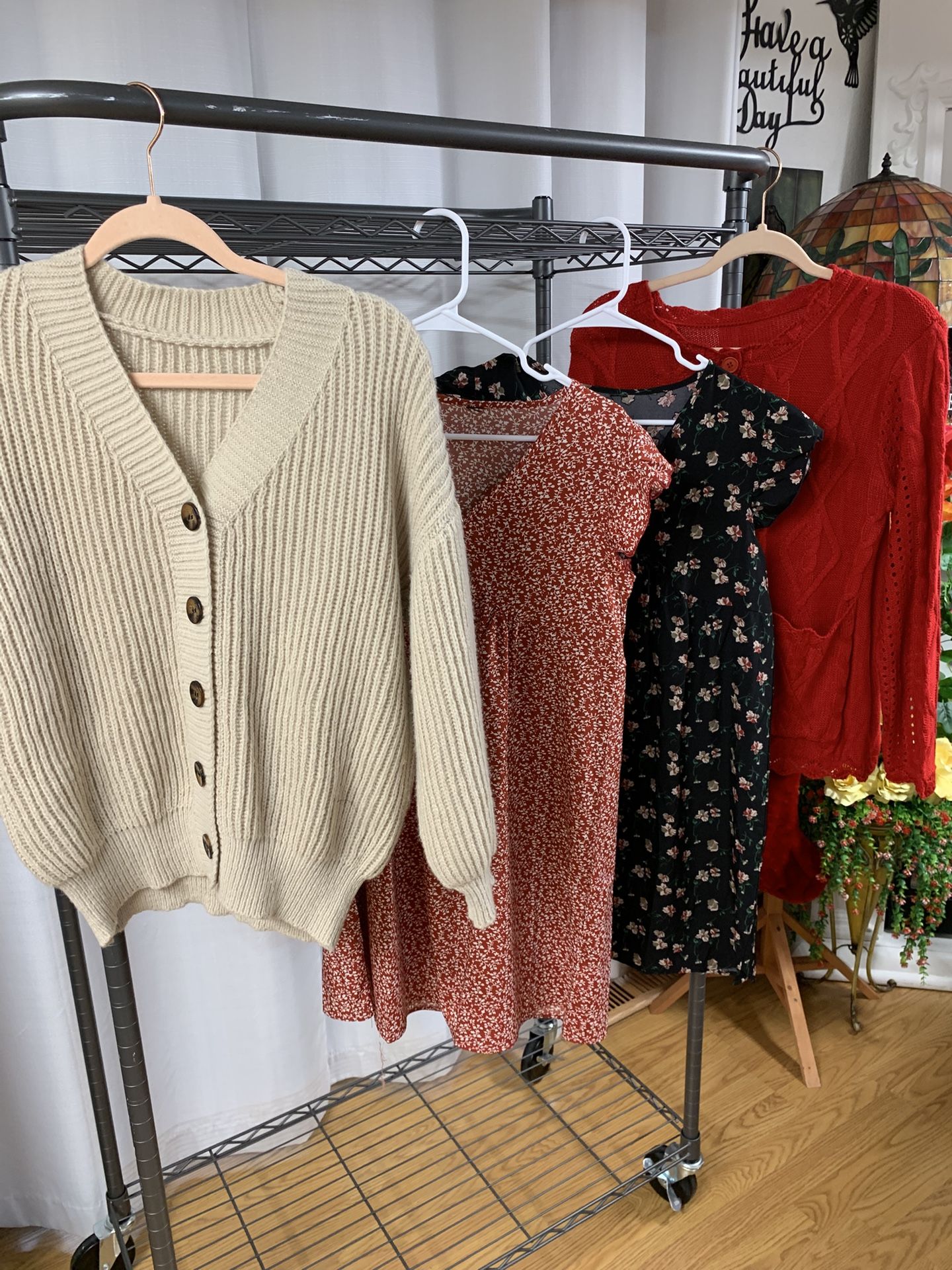 One Tan Cardigan, Two Floral Tops, And One Red Button Down Sweater With Pockets