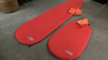 Adult and child Thermarest Prolite camping pads with cases