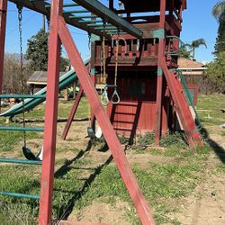 Wooden swing set in good used condition 