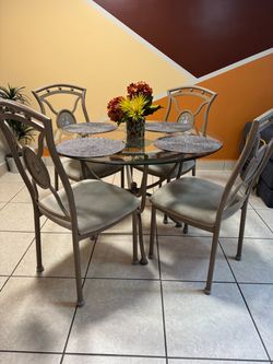 DINING ROOM SET.  Glass top 45” wide. 4 seats