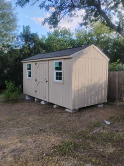8 x 16 storage/ shed included 1 door 2 shelves 2 windows