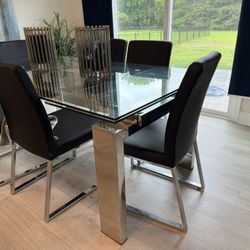 6 Black and Chrome Faux Leather Dining Chairs.