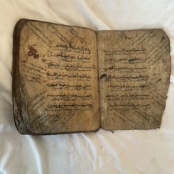 This appears to be a very old Quran or an Islamic or Arabic hand written book. I’m no expert…