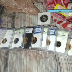 Graded Coins And A Romsn Coin For Sale