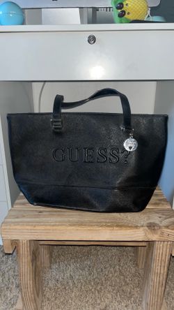 Woman’s black guess purse