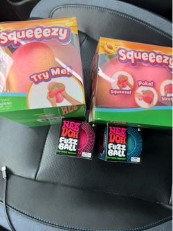 Two needoh fuzzballs and two peaches