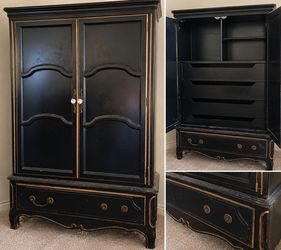 Black and gold armoire