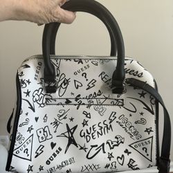 Like NEW Guess purse. Nice design of black print on white bag