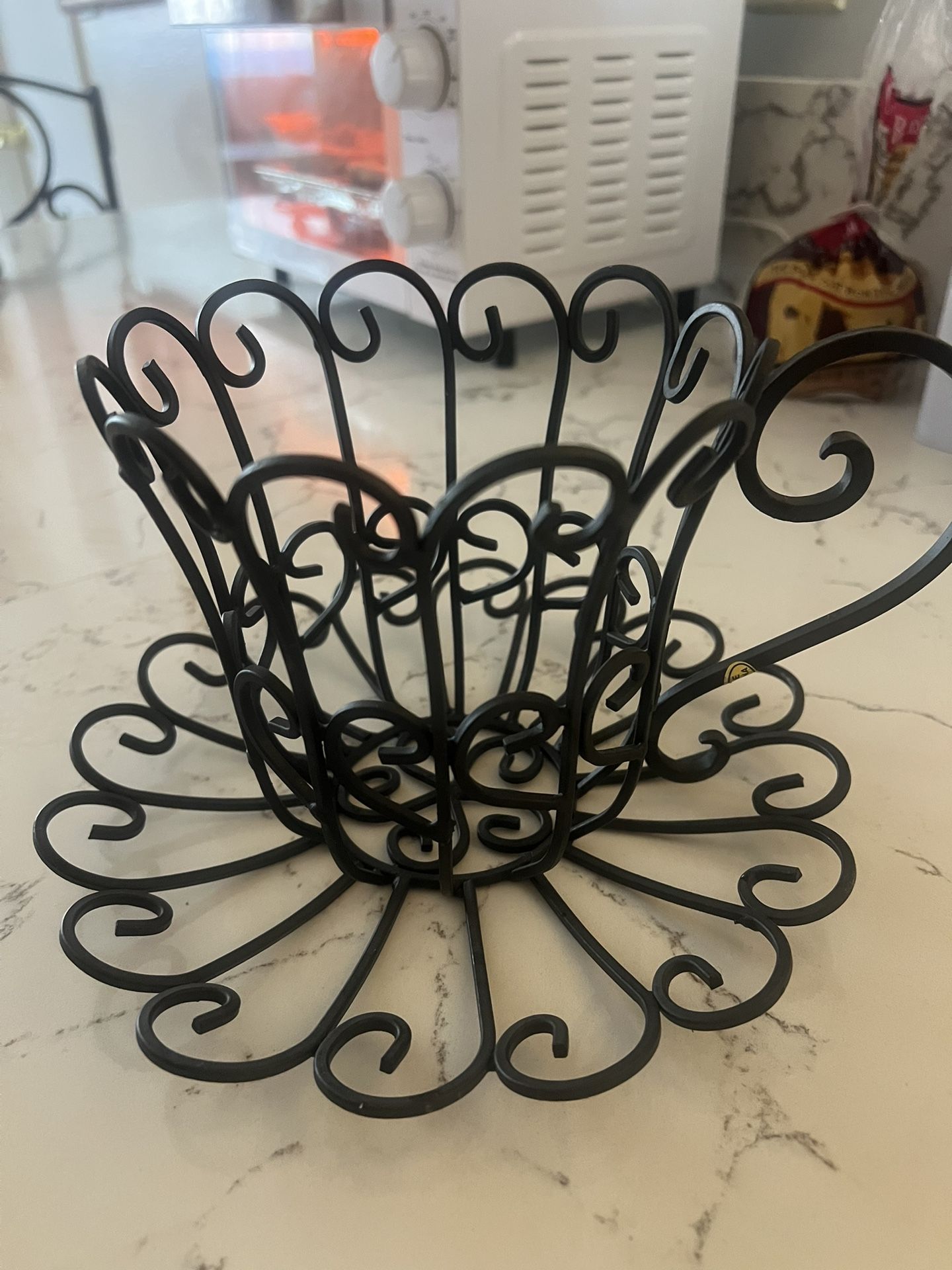 Black metal coffee plant holder