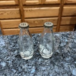 Vintage Glass Small Bottles Pair Of Salt and Pepper Shakers.  Size approximately 3 inches tall.  Preowned.  