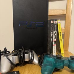 Japanese PlayStation 2 with games and controllers