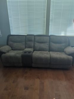 Modular suede reclining couch.