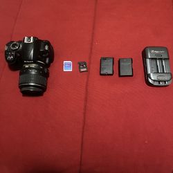 Nikon D3100 Camera W/ Charger Battery And SD Card