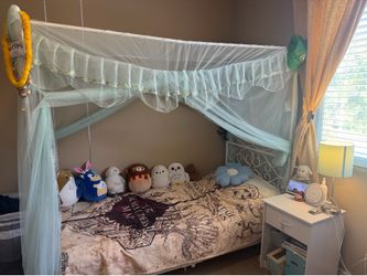 Twin size canopy bed with mattress