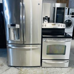GE refrigerator 36X69X29 and electric stove. Stainless steel. Includes a receipt for a 90-day warranty.s