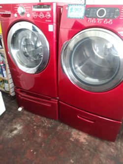 Front load washer LG and electric dryer Samsung set with pedestals in excellent conditions
