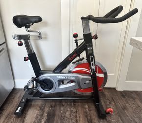 Sunny SF-B1002 Indoor Cycling Bike - 49 lb Flywheel + Upgraded Bikeroo Seat