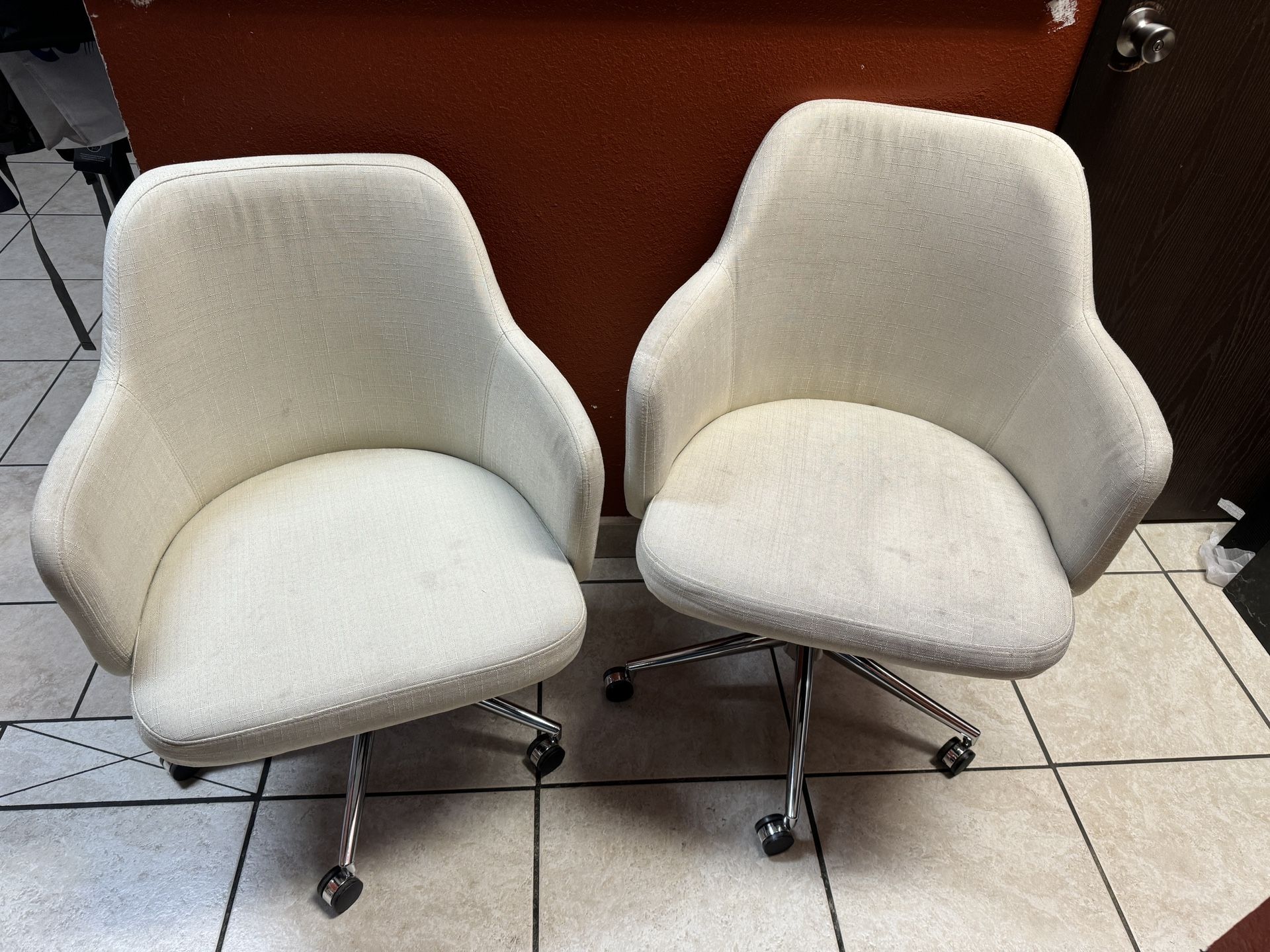 Pair Of Rolling chairs 