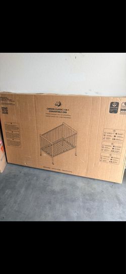 Crib converts to child size bed brand new,color brown
