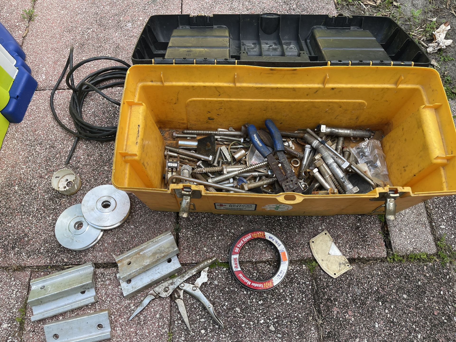 Yellow Toolbox With Miscellaneous Aluminum Piece And Bits
