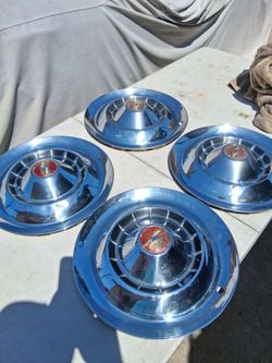 PRE-OWNED NOS "15 Hub caps for 1954 Chevrolet.
