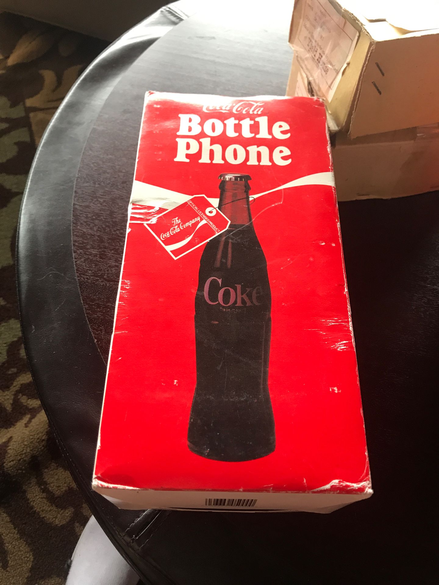 Coke bottle phone in box