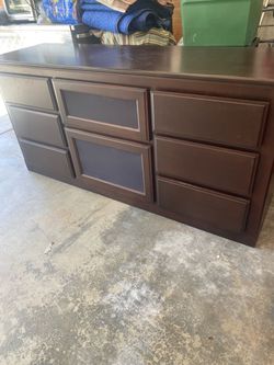 Dark Wood Dresser with Multiple Drawers