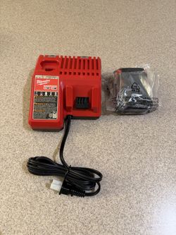 Brand new Milwaukee M18 Charger and 2 ah battery