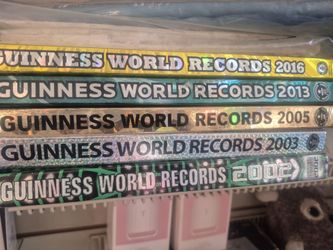 Guinness World Records books spanning the years 2002, 2003, 2005, 2013, and 2016.