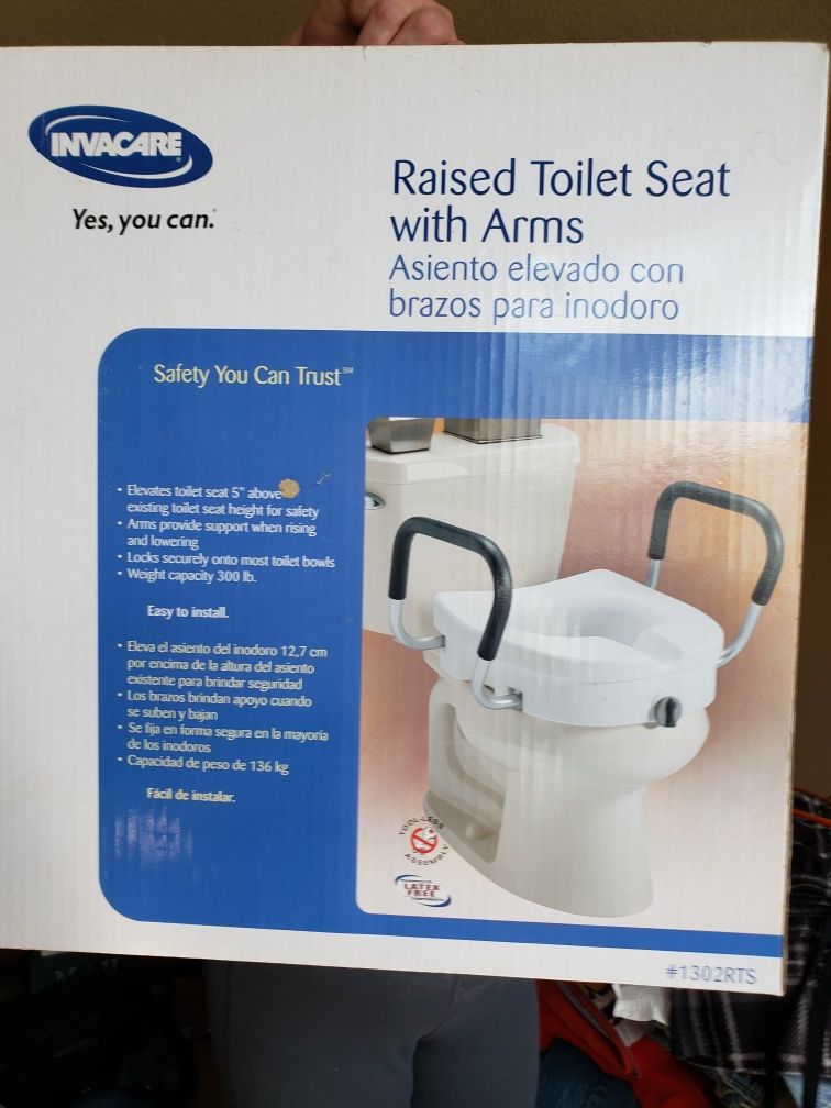 Invacare raised toilet seat with arms