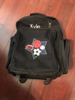 Embroidered roller back pack, name says kyle.