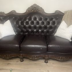 Brown leather couches.