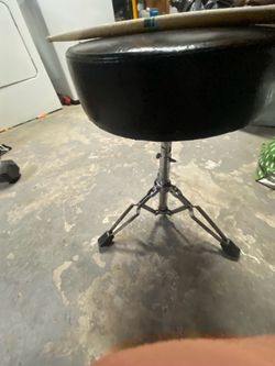 Drummer seat and drumsticks
