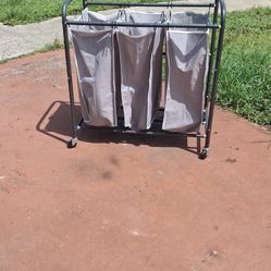 grey 3-section metal rolling laundry sorter cart