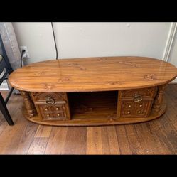 Oval wooden coffee table with storage