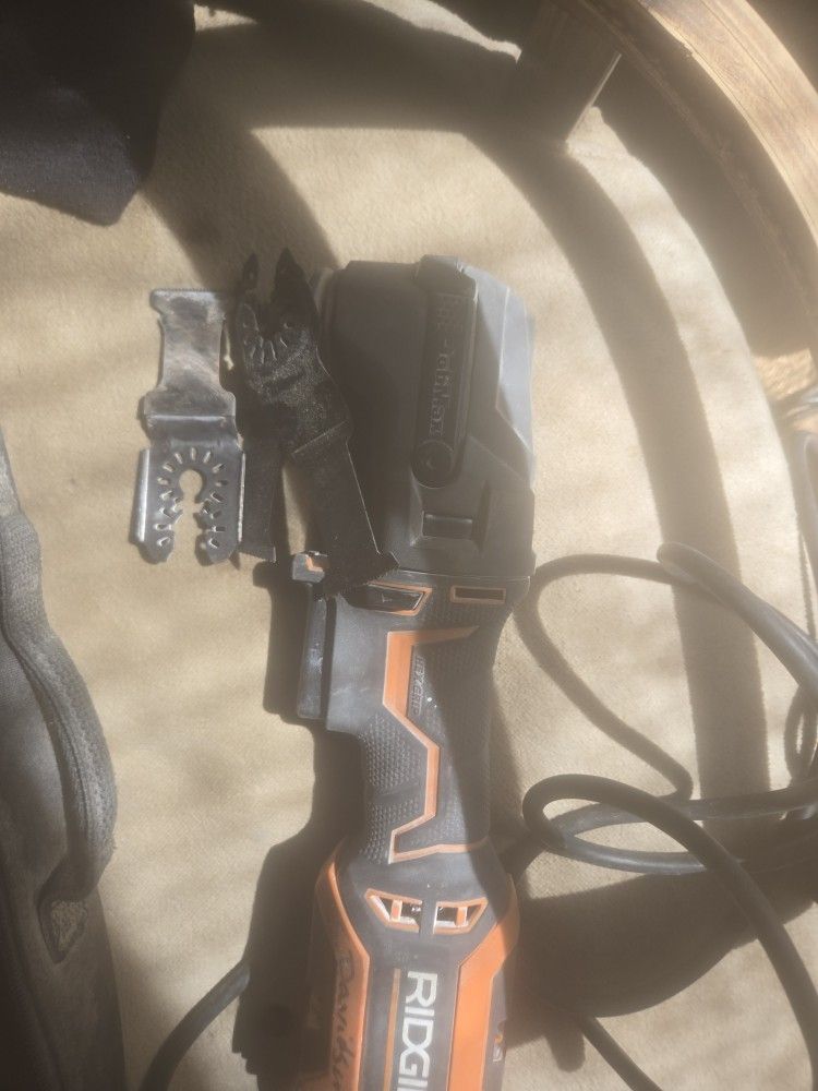 Rigid multi use tool with blades