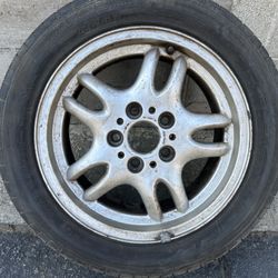 One 95-01 BMW three series 16 inch style 30 aluminum wheel & old tire