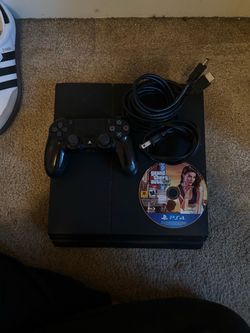 PS4 with a controller, cables, and GTA 5!