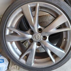 2 18" Lexus Rims With A New Tire On One