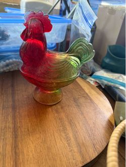 Rooster on a nest
