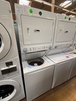 GE washing machine and gas dryer laundry cabinet
