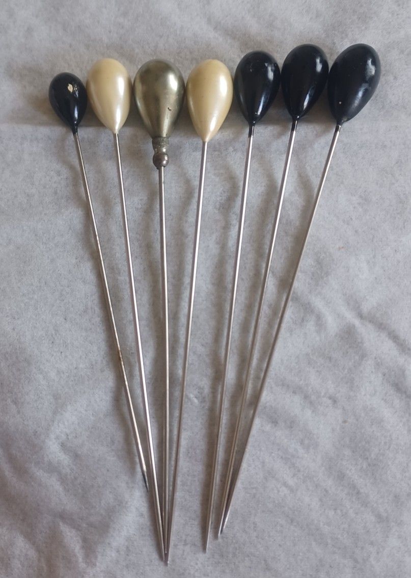 Set of 7 1940's vintage hat pins.