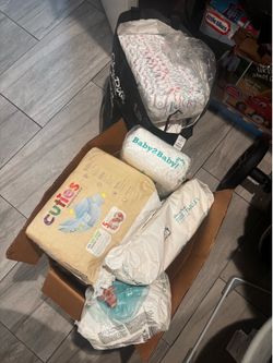 A brunch of diapers! And Huggies !