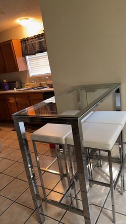 Glass table with bar stools.