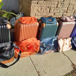 Maleta Carry On 20 inches Más 2 bolsas 