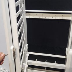 Jewlery cabinet with mirror.