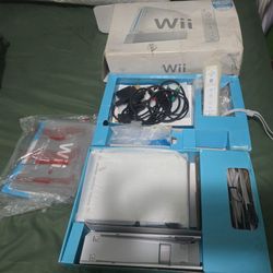 White Wii console with box and manuals