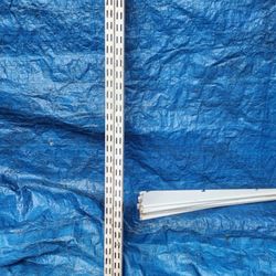 Garage wall shelving with adjustable supports