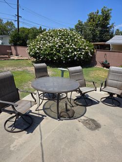 Table and swivel chairs